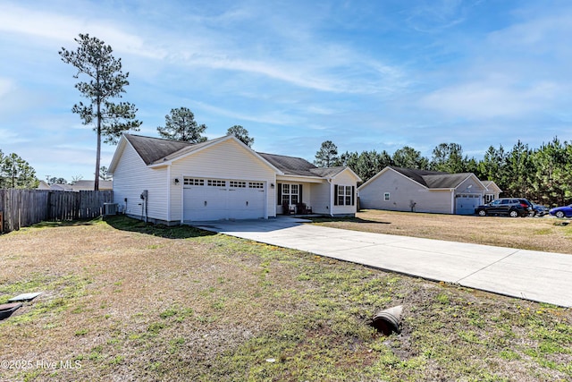 single story home with a front yard, fence, an attached garage, central AC, and concrete driveway