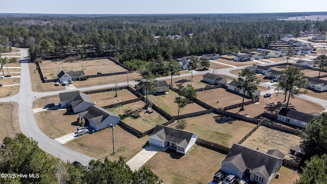 bird's eye view with a residential view and a forest view