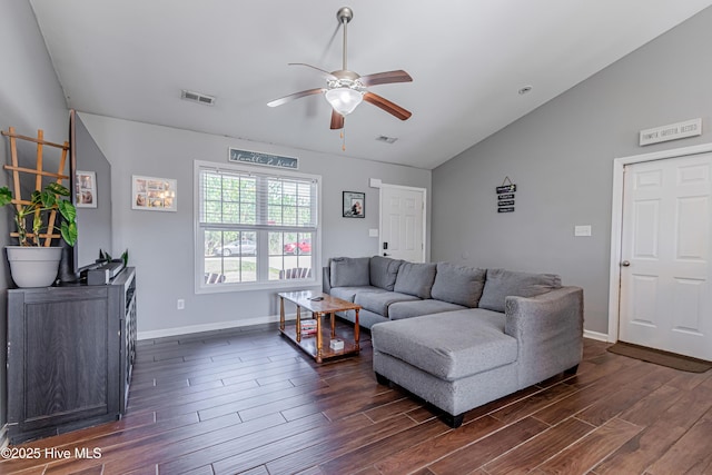 living area featuring vaulted ceiling, a ceiling fan, visible vents, and dark wood-style flooring