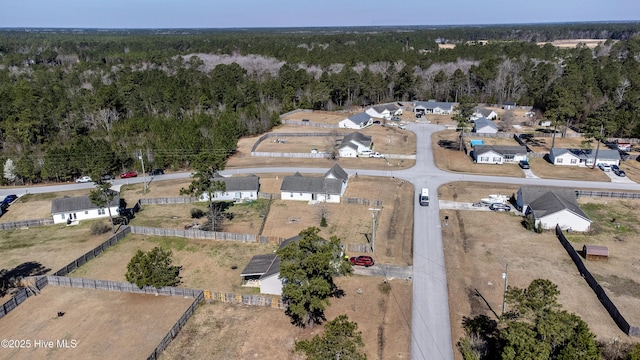 drone / aerial view featuring a view of trees