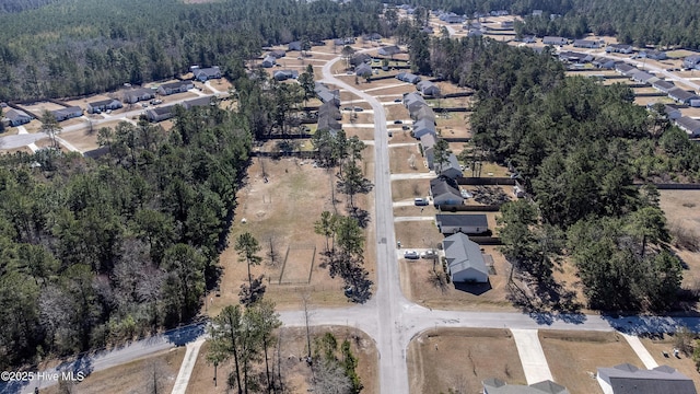 aerial view with a forest view and a residential view