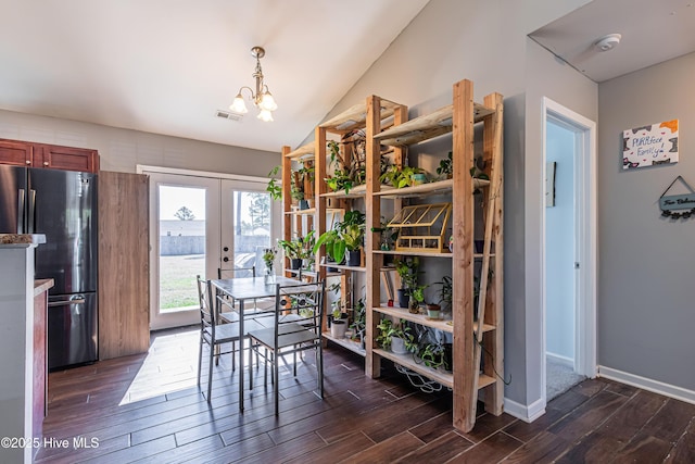 dining area with visible vents, dark wood-style flooring, and french doors