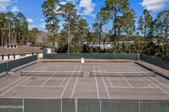 view of tennis court with fence