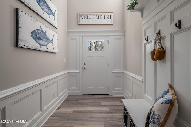 interior space featuring light wood-style floors and a decorative wall