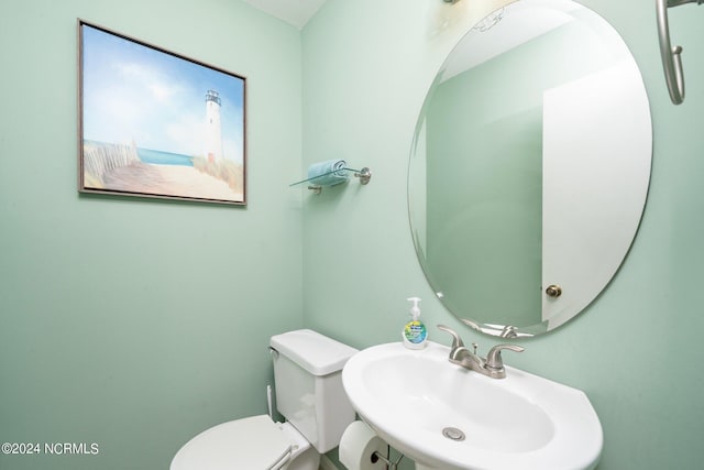 bathroom with toilet and a sink