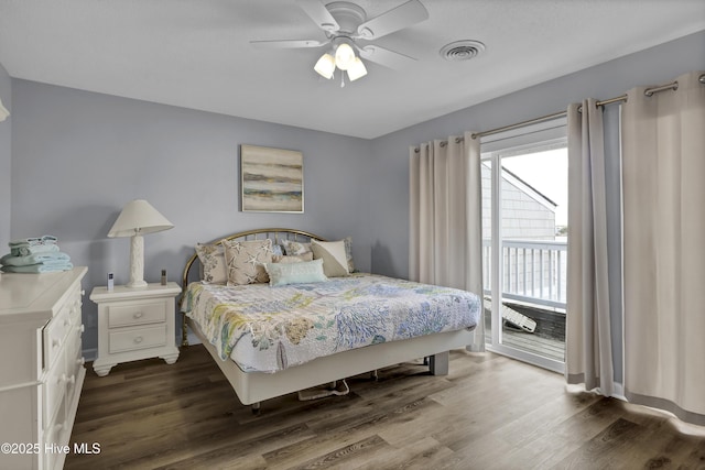 bedroom featuring ceiling fan, access to outside, dark wood-style flooring, and visible vents