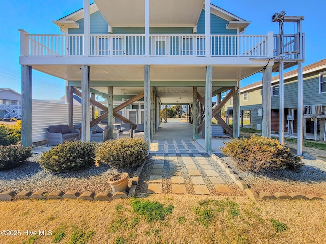 exterior space with a carport and stairs