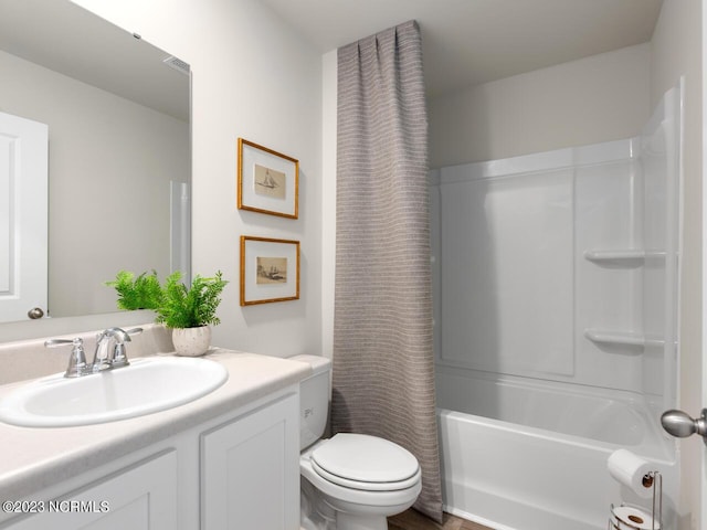 bathroom with toilet, shower / tub combo, visible vents, and vanity