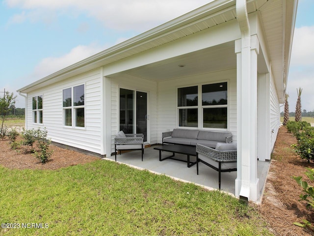 back of house featuring a patio area, an outdoor hangout area, and a yard