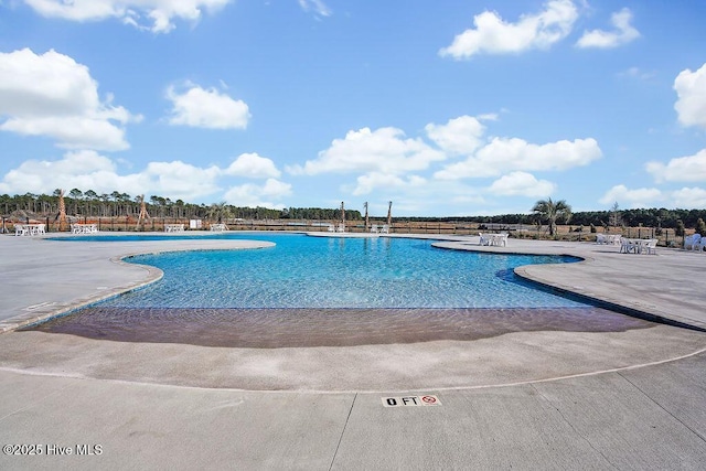 pool featuring a patio area