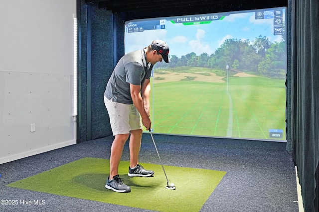 game room with golf simulator