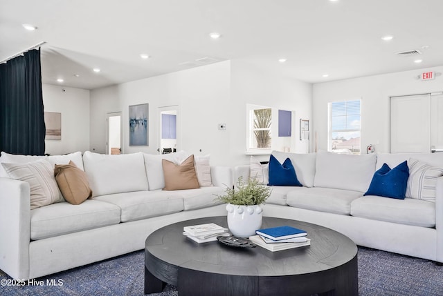 living area with visible vents and recessed lighting