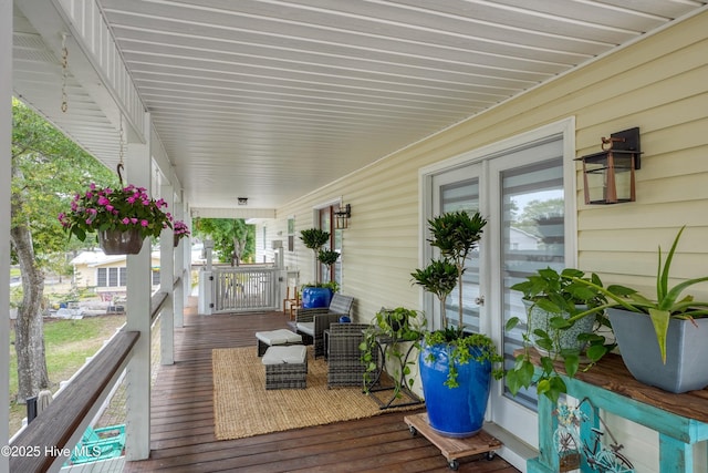 deck featuring covered porch