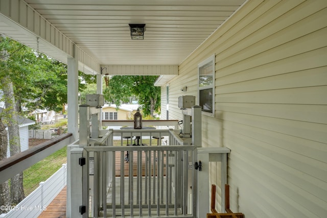 wooden deck featuring covered porch