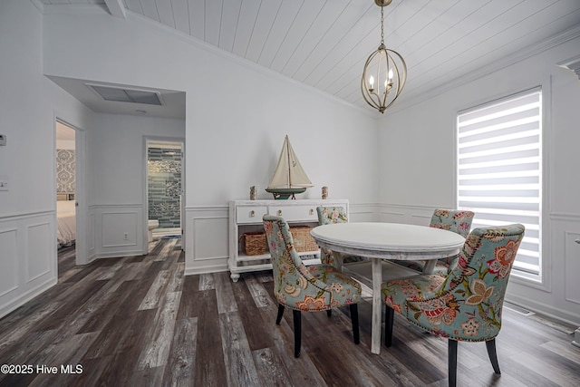 dining area with wooden ceiling, dark wood-style floors, ornamental molding, vaulted ceiling, and a chandelier