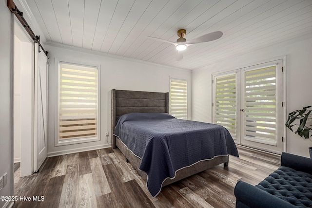 bedroom featuring a barn door, wooden ceiling, wood finished floors, access to outside, and crown molding