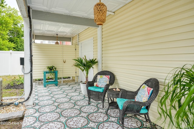 view of patio featuring fence