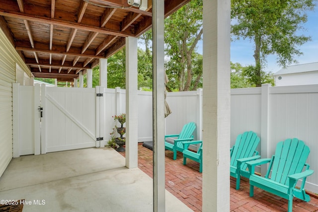 view of patio / terrace featuring a fenced backyard and a gate