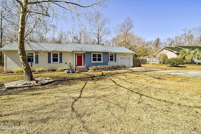 single story home featuring an attached garage, fence, and driveway