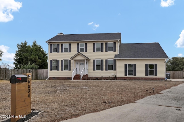 colonial inspired home featuring crawl space, a chimney, roof with shingles, and fence