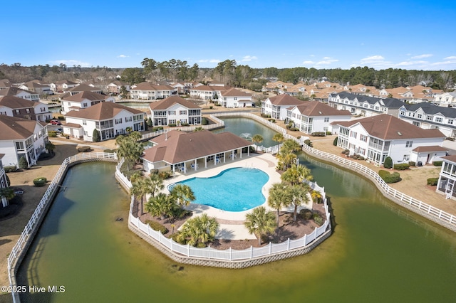 bird's eye view featuring a residential view and a water view