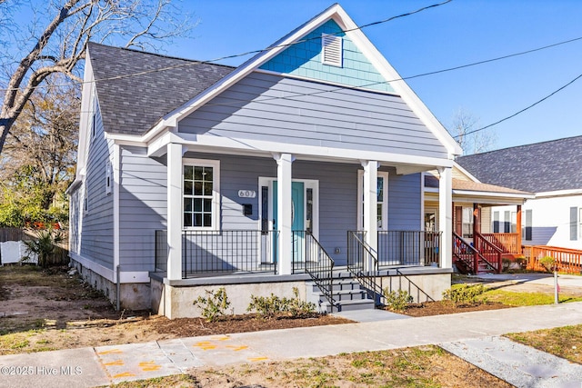 view of front of home featuring a porch and a shingled roof