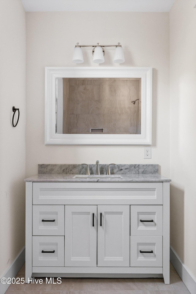 bathroom featuring vanity and baseboards