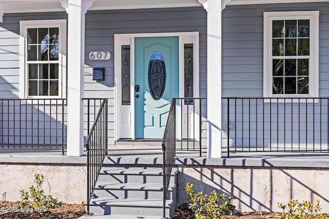 property entrance with covered porch