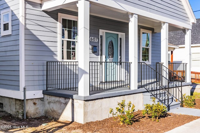 entrance to property featuring a porch