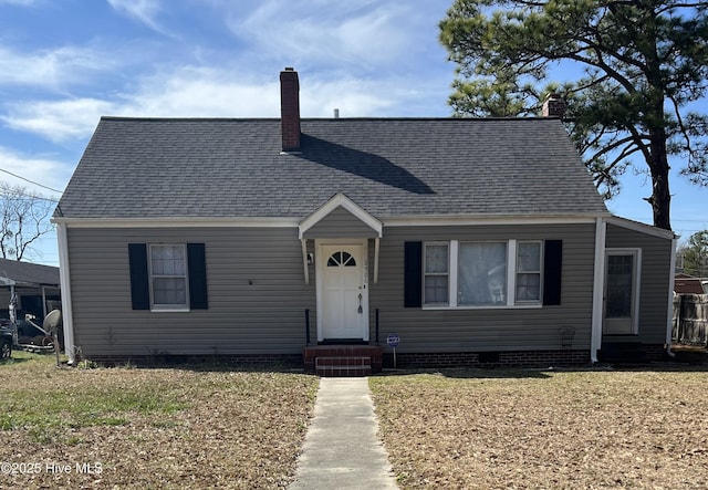 view of front of property featuring entry steps, crawl space, roof with shingles, and a chimney