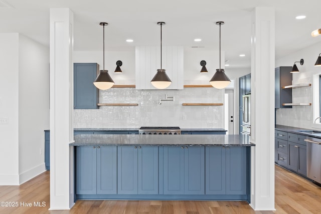 kitchen featuring hanging light fixtures, light wood-style flooring, open shelves, and dishwasher