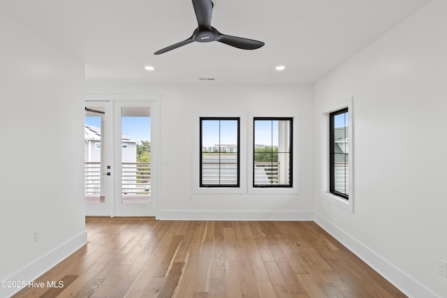 unfurnished room featuring visible vents, baseboards, ceiling fan, light wood-type flooring, and recessed lighting