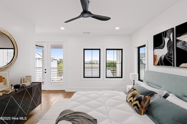 bedroom with recessed lighting, a ceiling fan, baseboards, light wood-style floors, and access to exterior