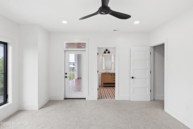 unfurnished bedroom with recessed lighting, baseboards, and light colored carpet