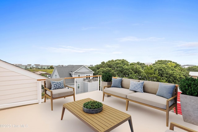 view of patio / terrace with an outdoor living space and a balcony