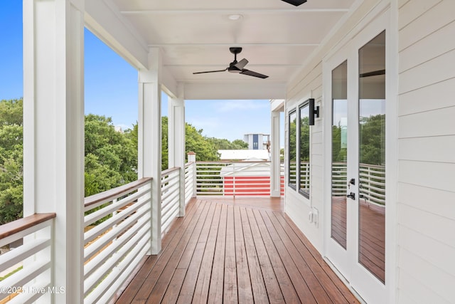 wooden deck featuring a ceiling fan