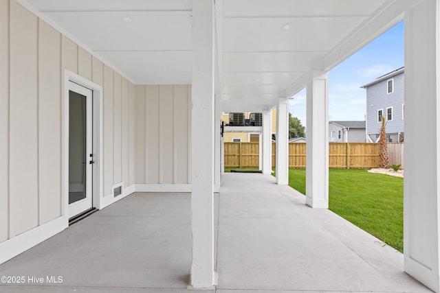 view of patio / terrace with fence and visible vents