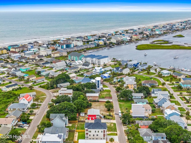 bird's eye view with a water view and a residential view