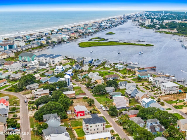 drone / aerial view with a residential view and a water view