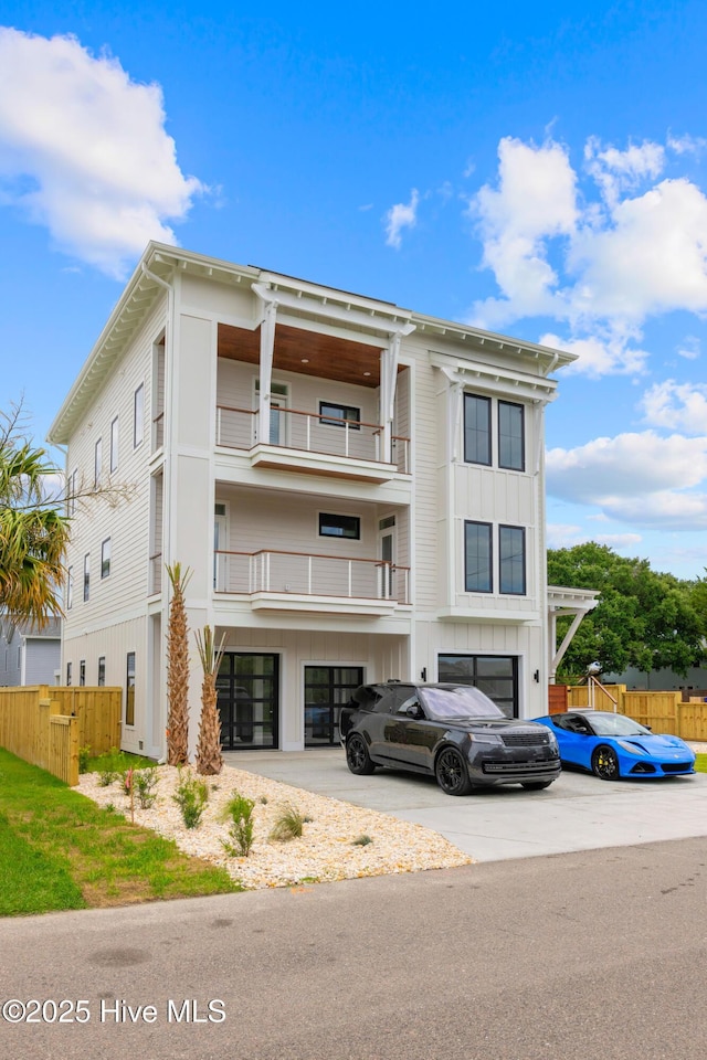 view of building exterior featuring driveway and an attached garage