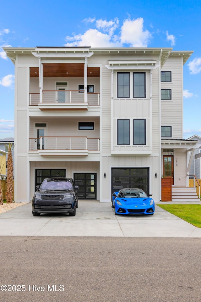 view of front facade with driveway, an attached garage, and board and batten siding