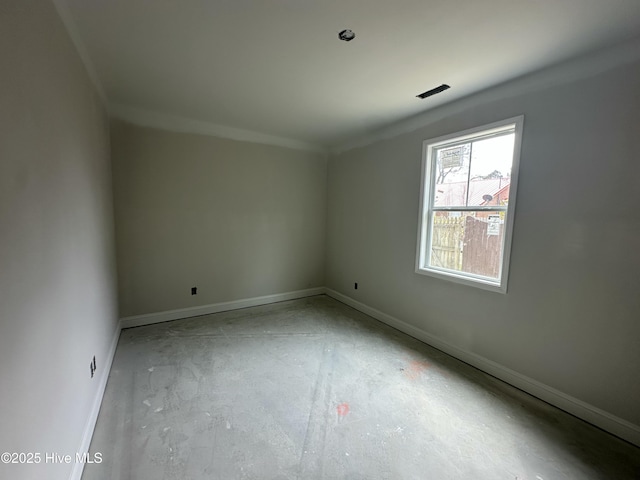 unfurnished room with baseboards