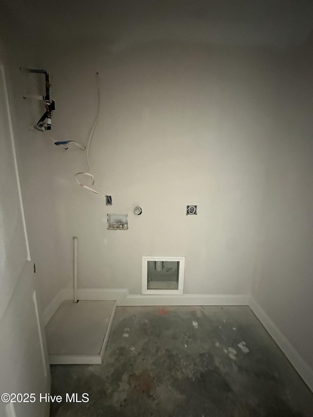 laundry area featuring baseboards