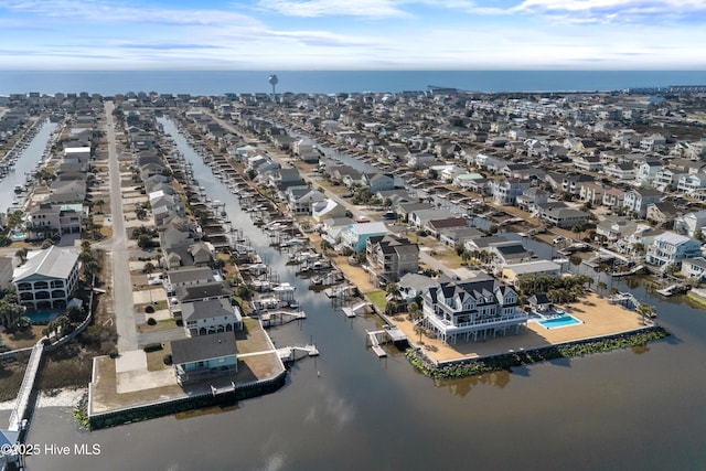 bird's eye view featuring a residential view and a water view