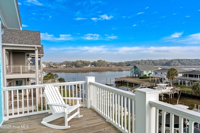 wooden deck with a water view