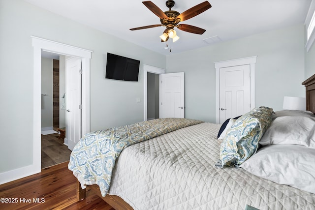 bedroom featuring visible vents, ceiling fan, baseboards, and wood finished floors