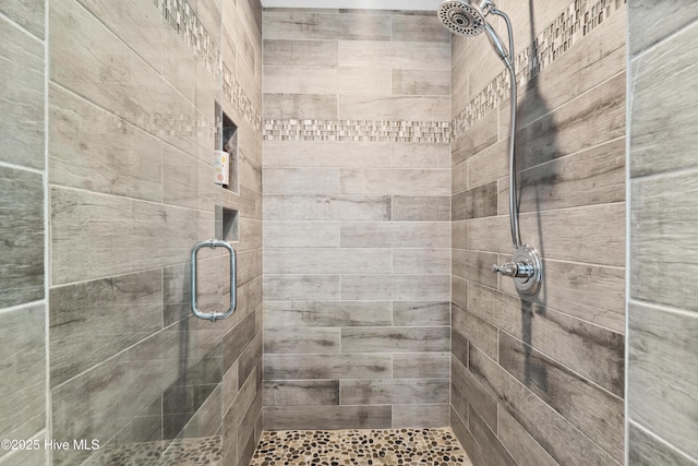 bathroom featuring a stall shower