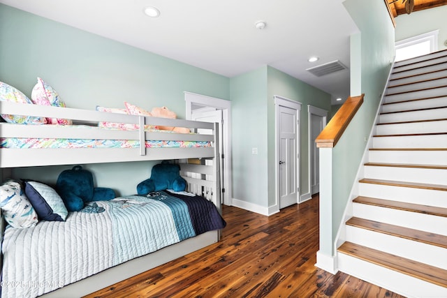 bedroom featuring baseboards, dark wood finished floors, visible vents, and recessed lighting