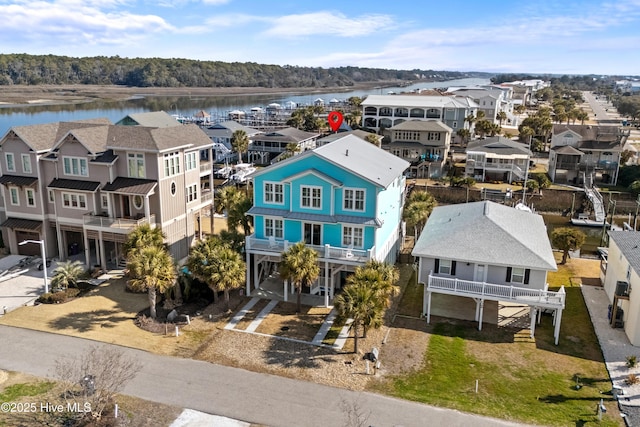 aerial view with a water view and a residential view