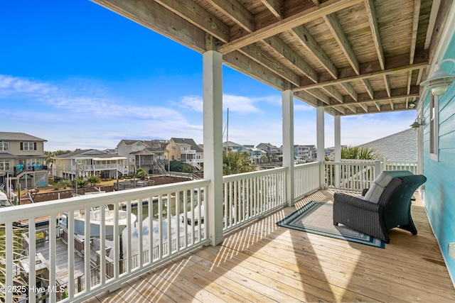 wooden deck featuring a residential view